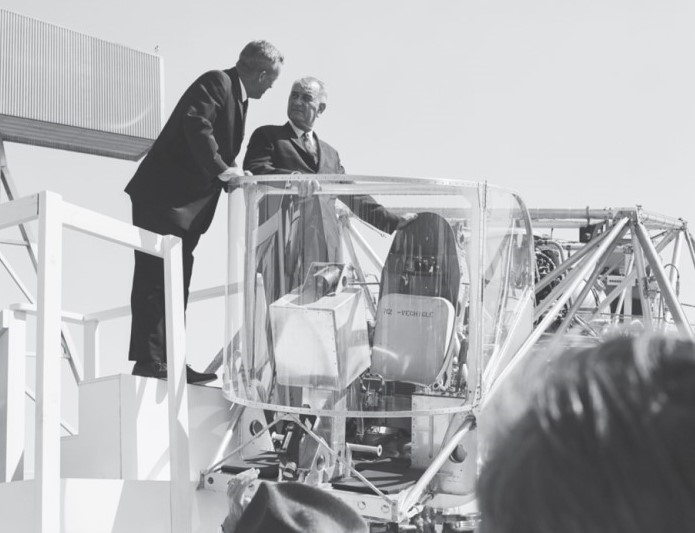 NASA chief test pilot Joseph “Joe” A. Walker demonstrates the features of LLRV-1 to President Lyndon B. Johnson during his visit to FRC