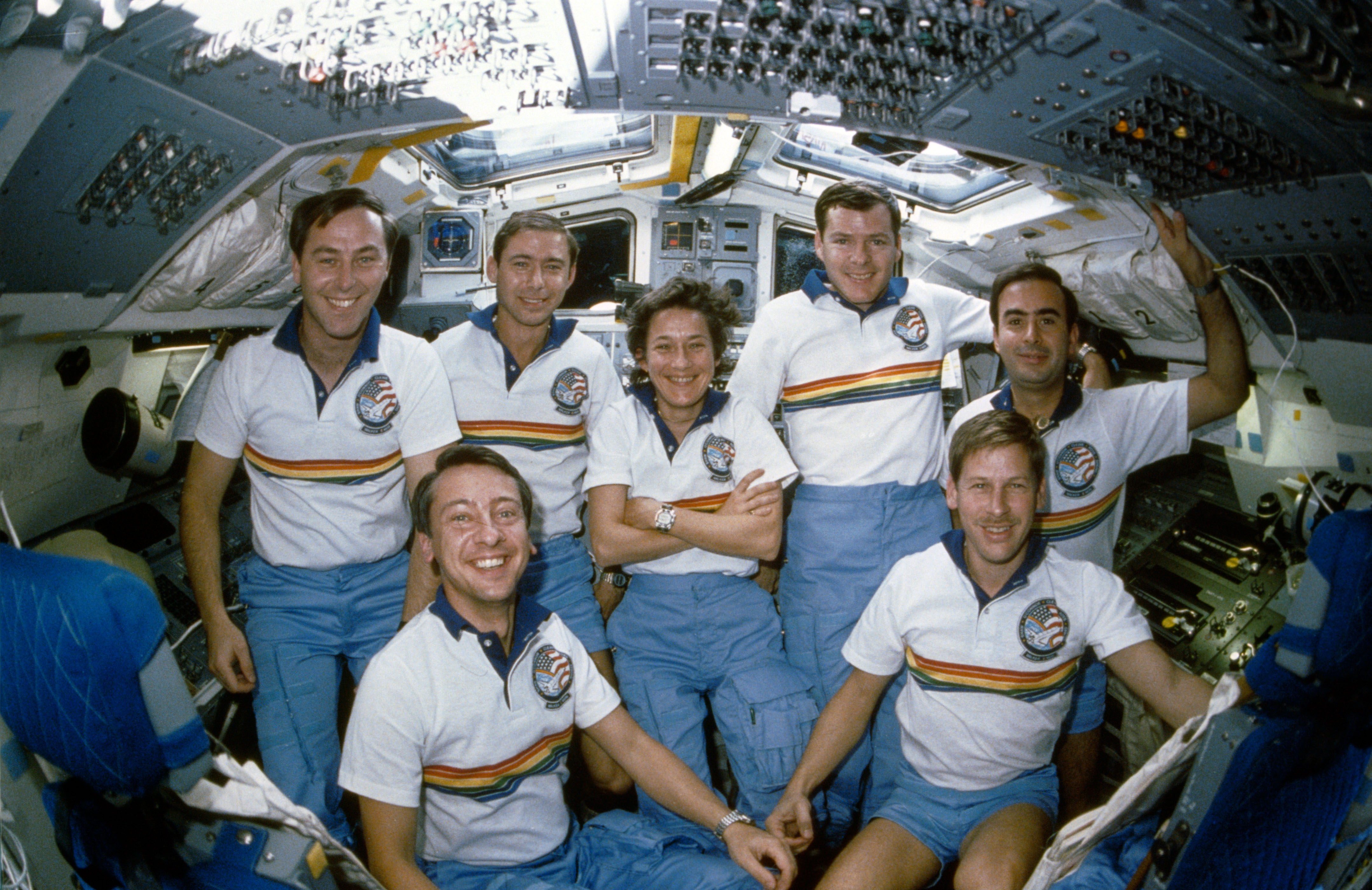 STS 61-B crew photographed on the flight deck of the earth-orbiting Atlantis