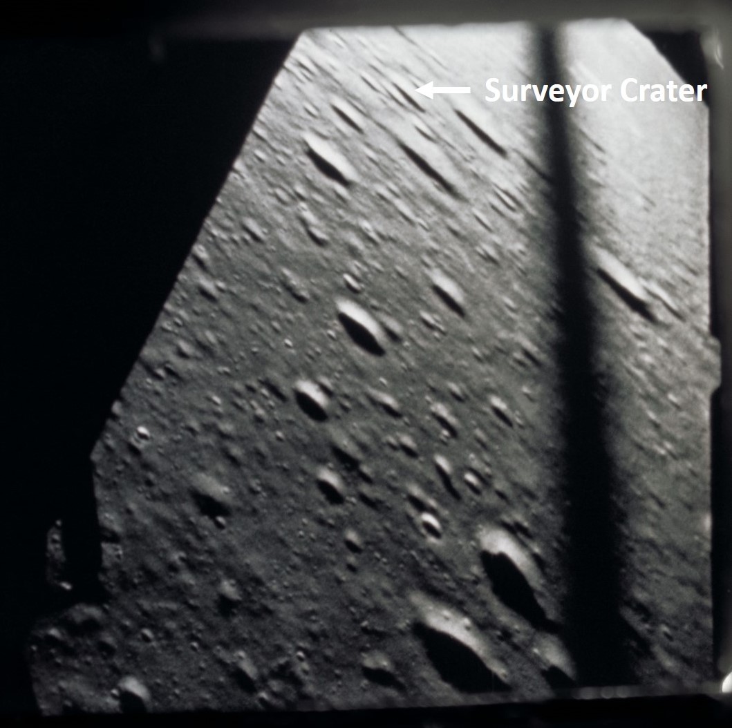 Still from 16 mm film looking out Alan L. Bean’s window at about 3,500 feet during the descent, showing the location of Surveyor Crater, the Apollo 12 landing site