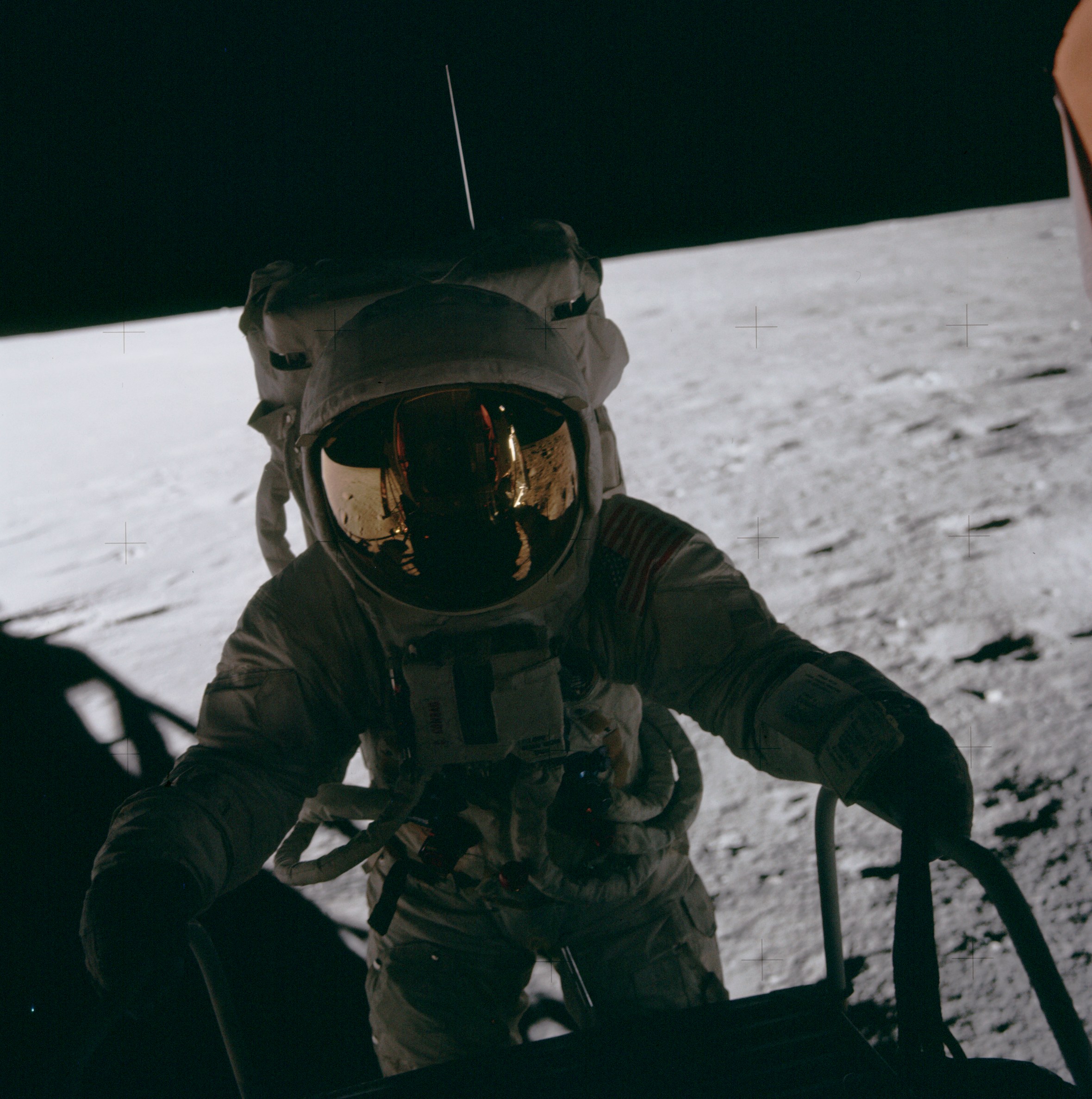 Charles “Pete” Conrad on the Lunar Module ladder about to descend to the surface