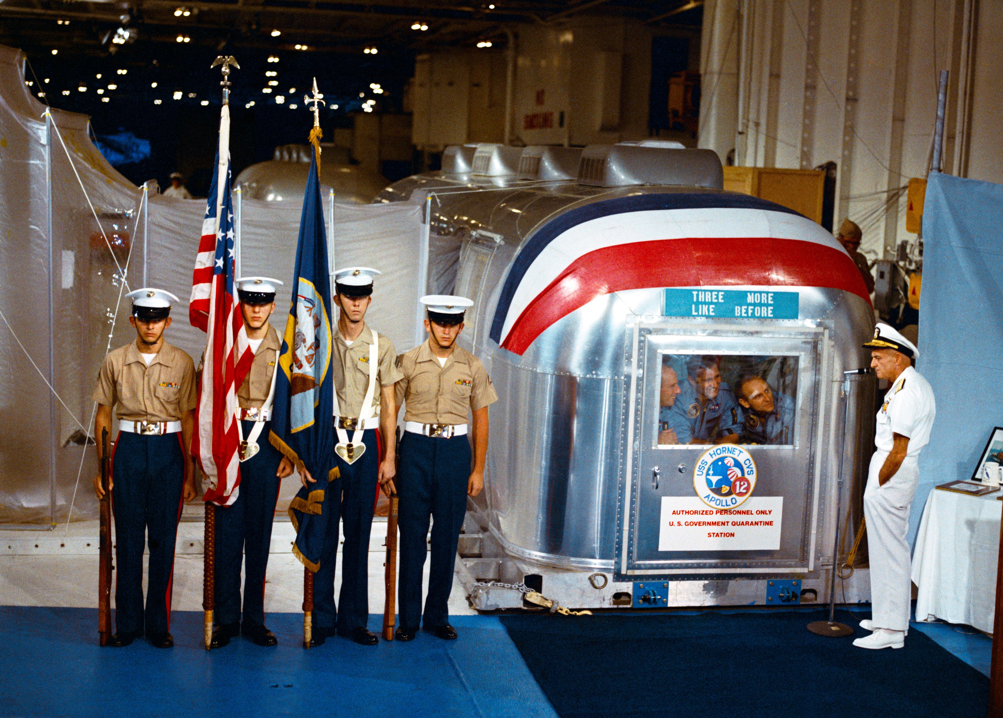 Admiral John S. McCain addresses the Apollo 12 astronauts in the MQF