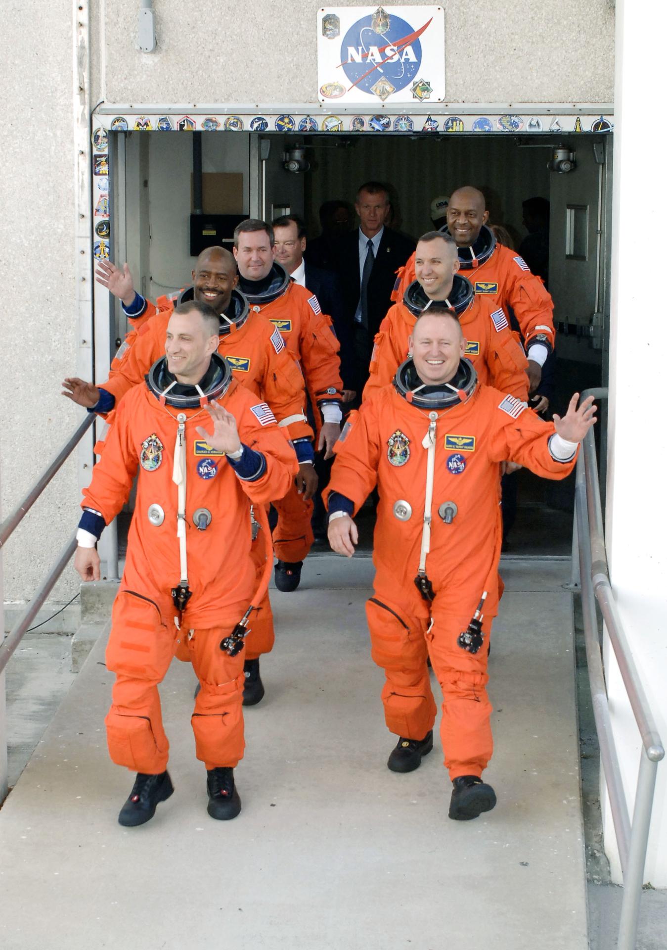 The STS-129 astronauts leave crew quarters for the ride to Launch Pad 39A