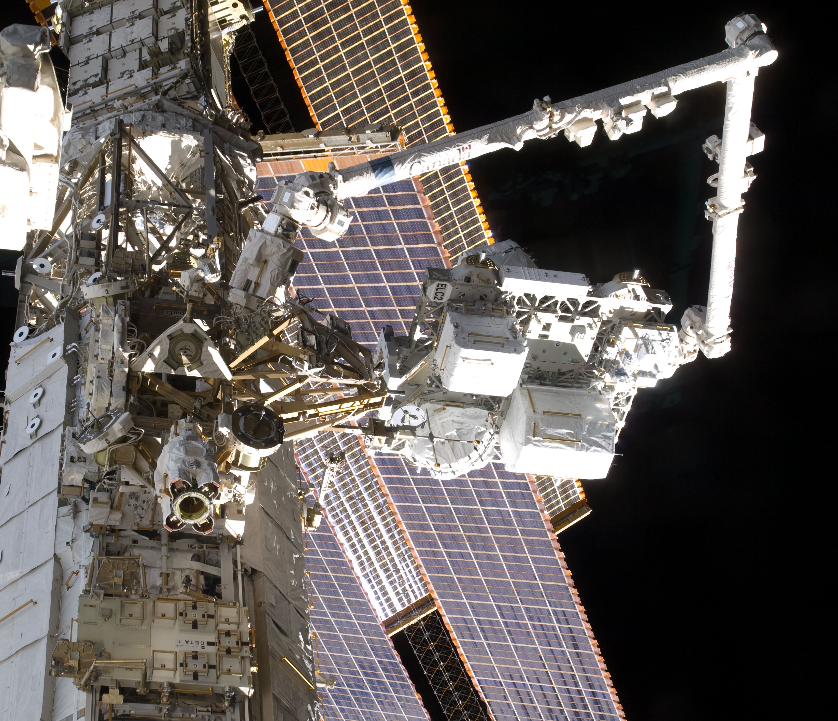 The station robotic arm installs ELC2 on the S3 truss