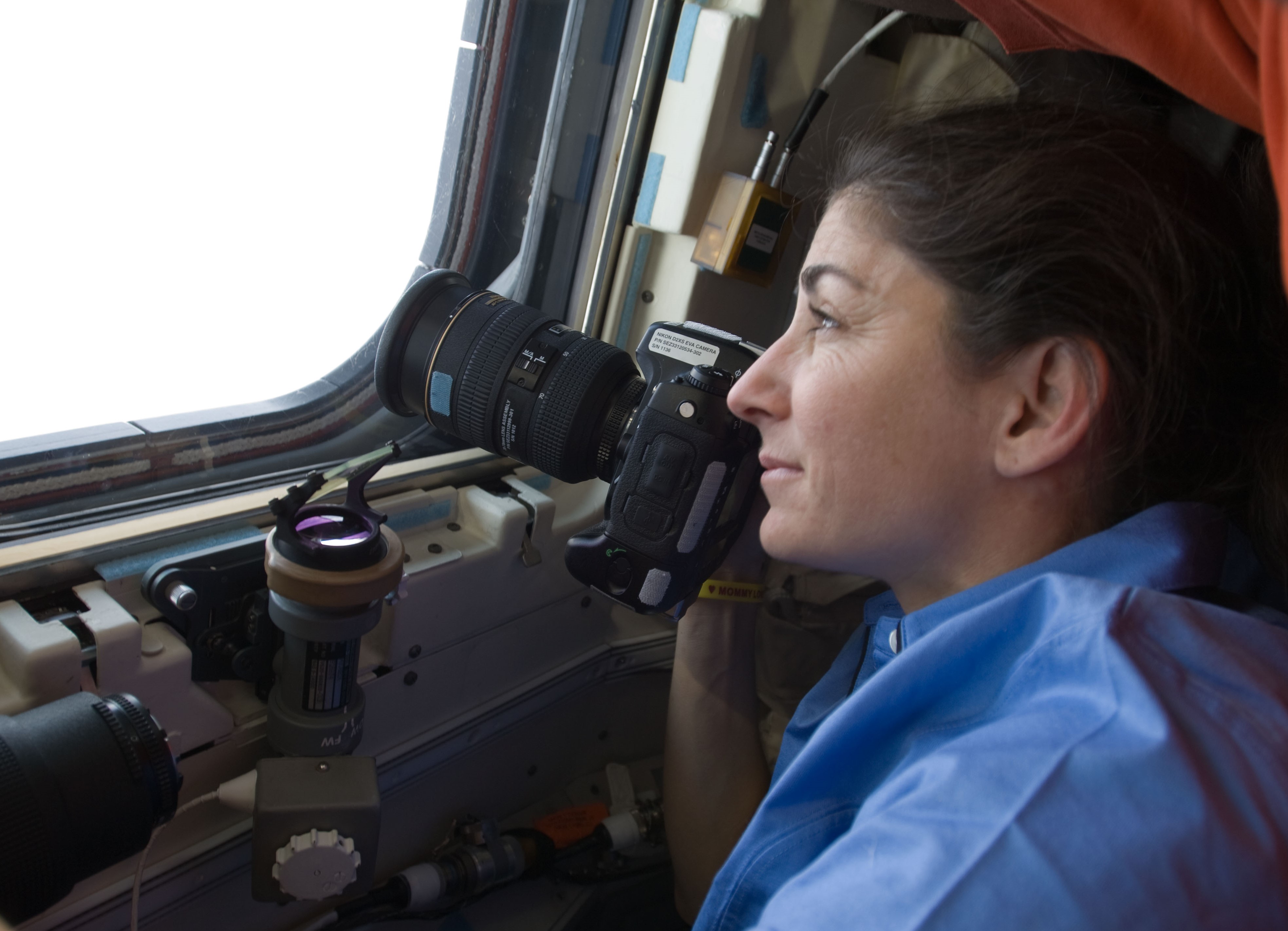 Astronaut Nicole P. Stott looks back at the station,