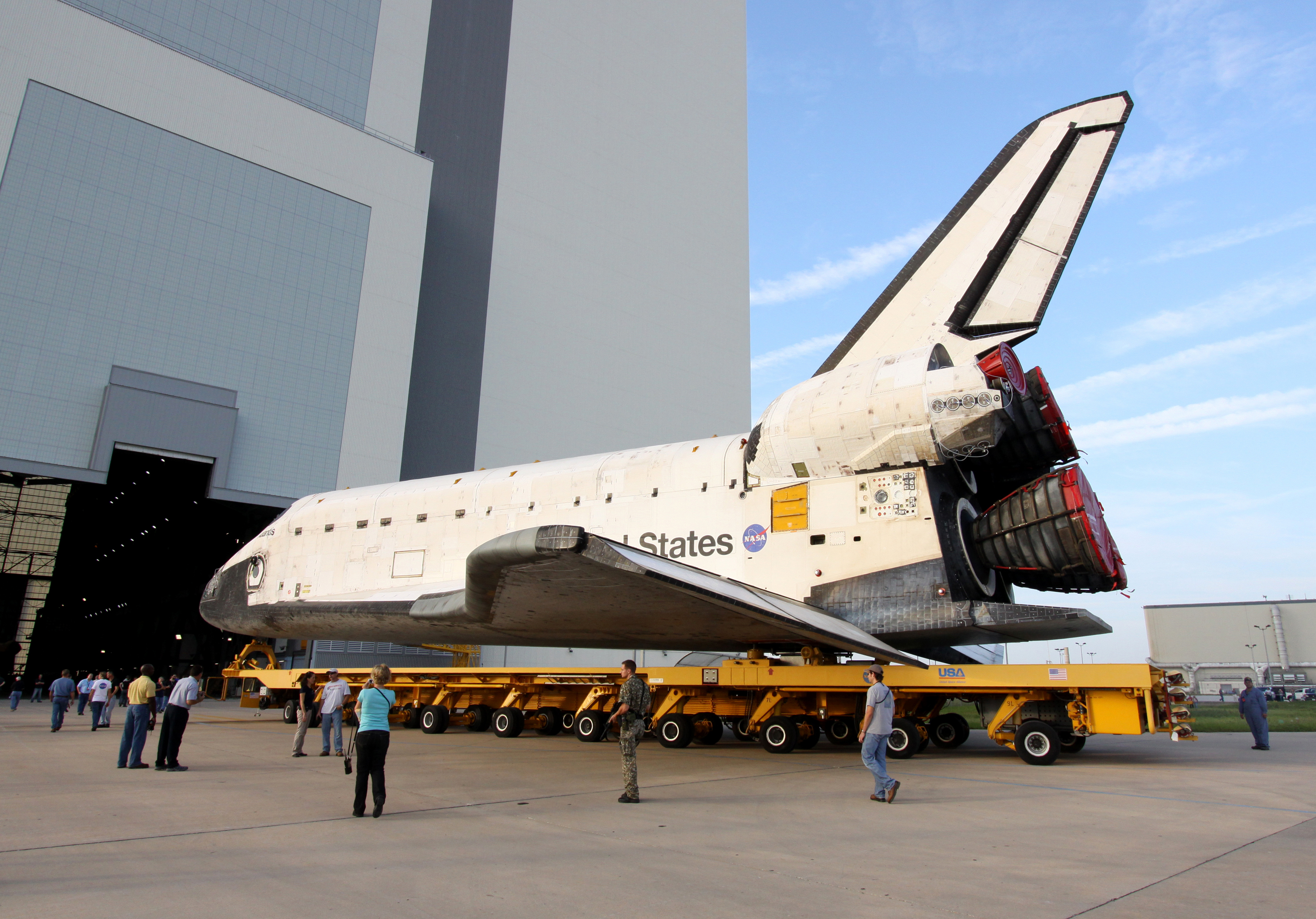 Space shuttle Atlantis rolls over from the OPF to the Vehicle Assembly Building