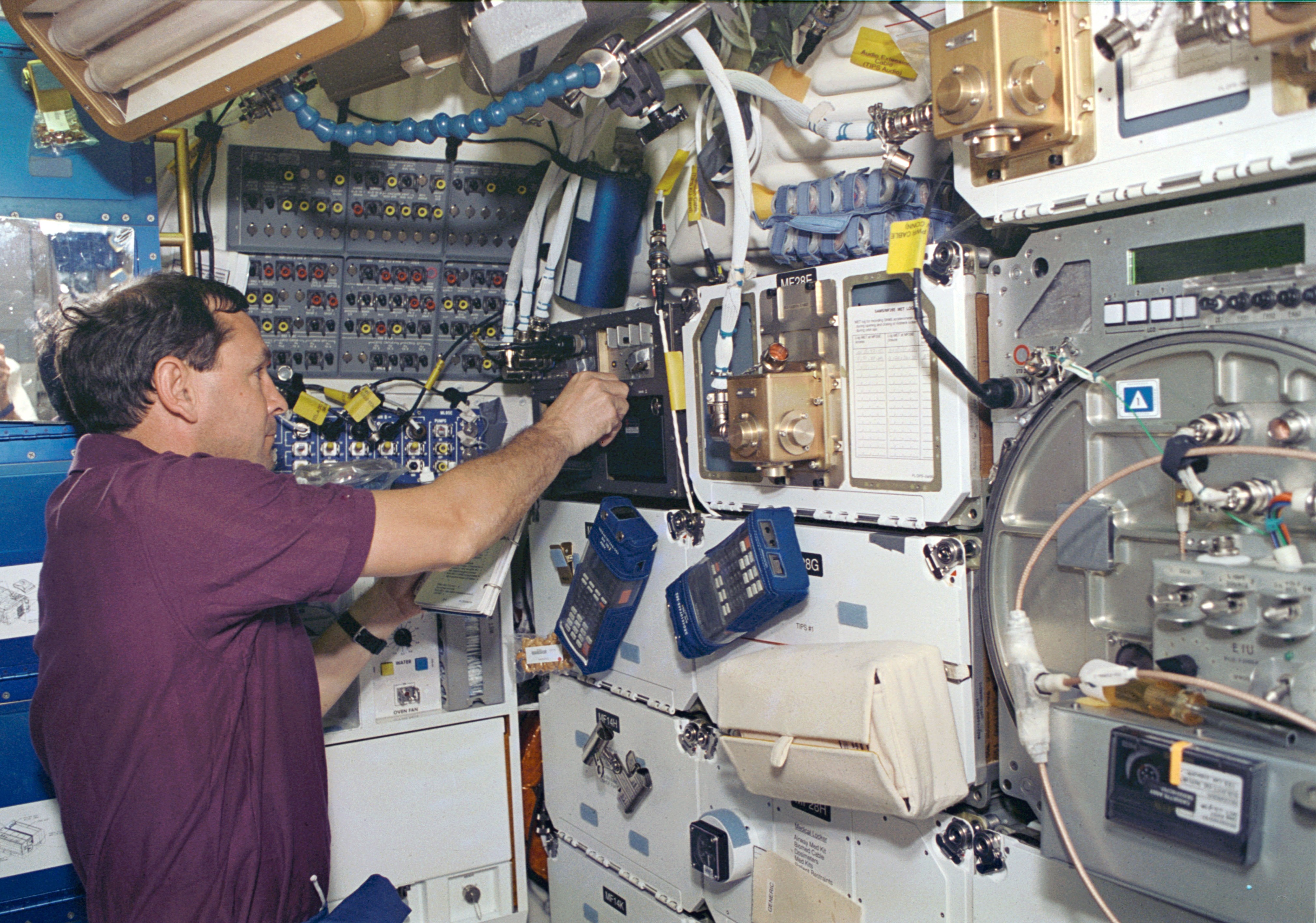 Curtis L. Brown operates a microgravity acceleration measurement system