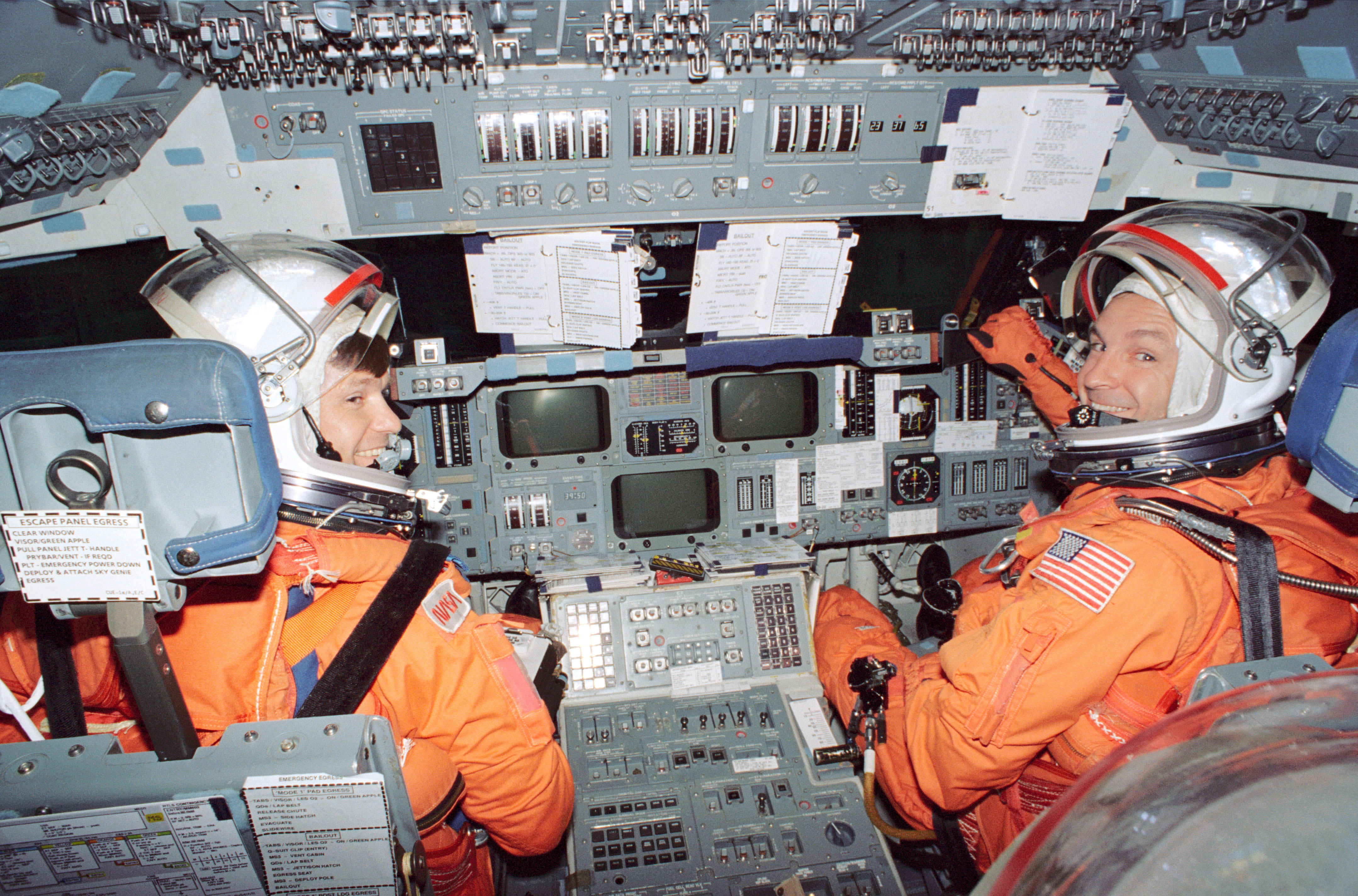 Donald R. McMonagle and Curtis R. Brown prepare for Atlantis’ deorbit and reentry