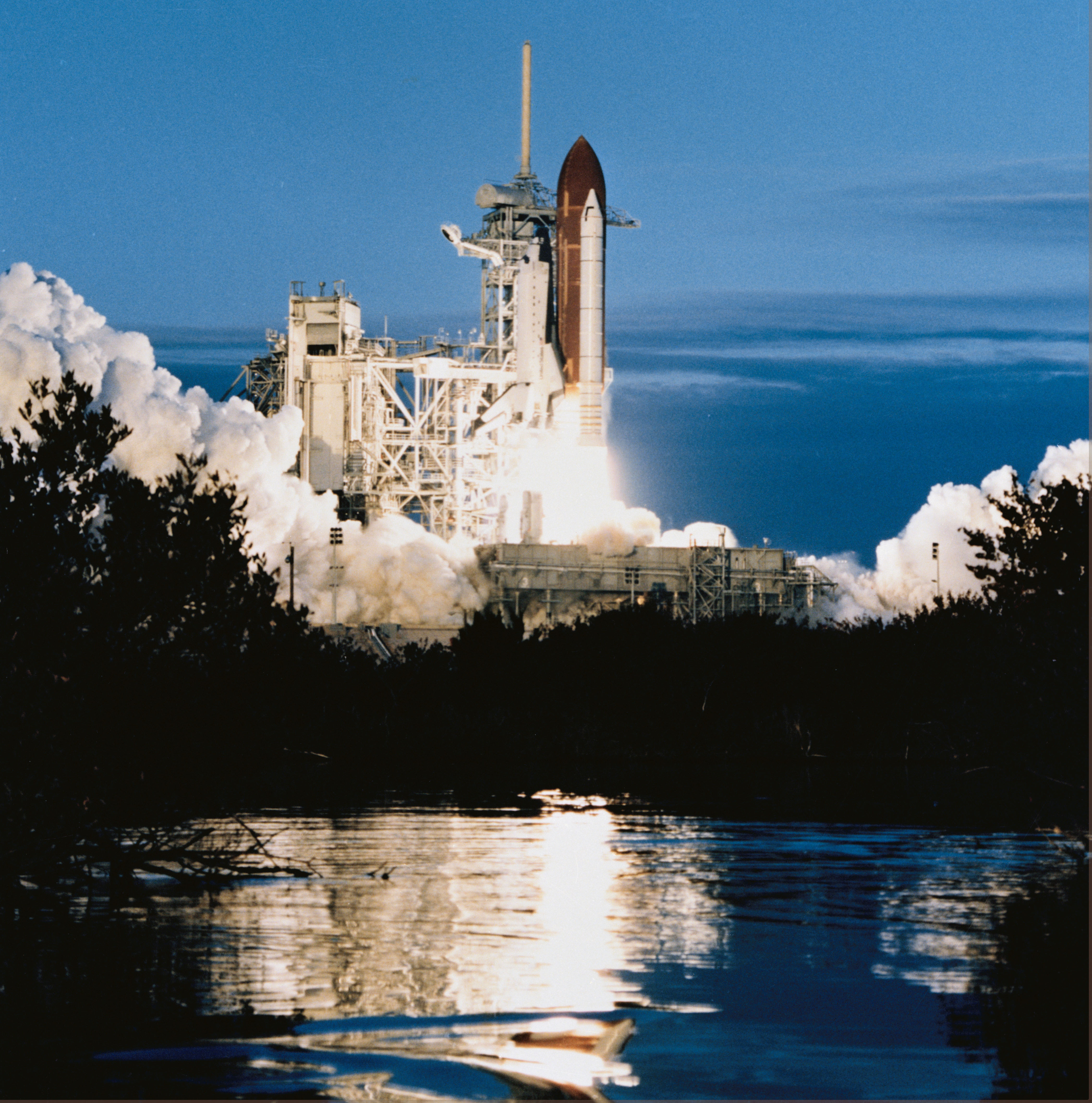 Image of a space shuttle lifting off on a pillar of flame.